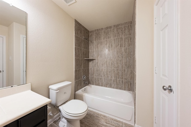 full bathroom with washtub / shower combination, visible vents, vanity, and toilet