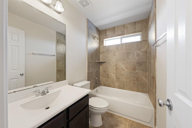 bathroom with toilet, vanity, visible vents, shower / washtub combination, and tile patterned floors