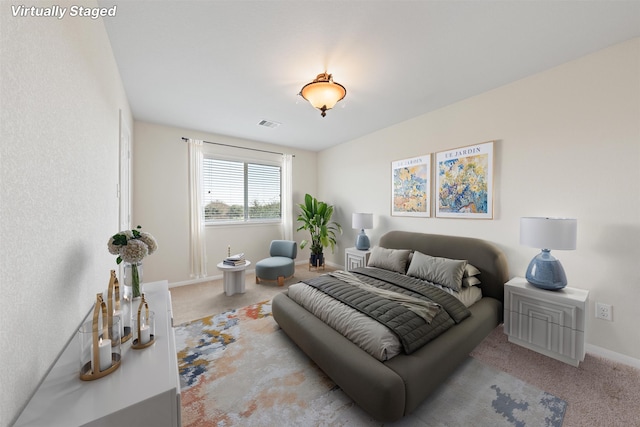 carpeted bedroom with baseboards