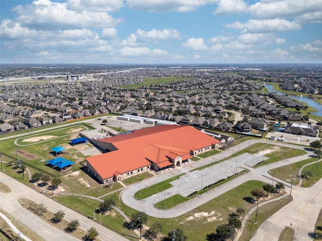 drone / aerial view with a residential view and a water view