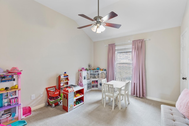 rec room featuring carpet, vaulted ceiling, baseboards, and ceiling fan