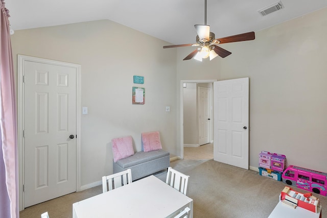 playroom with light carpet, baseboards, visible vents, a ceiling fan, and vaulted ceiling