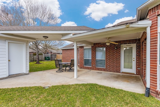 view of patio / terrace with ceiling fan and fence