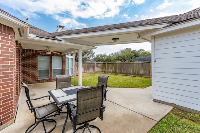 view of patio with outdoor dining area and a fenced backyard