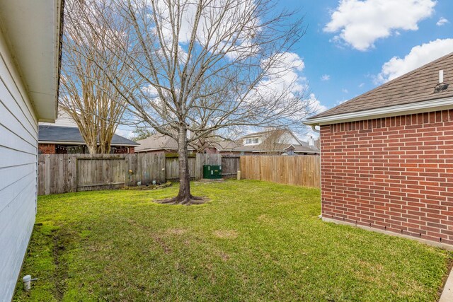 view of yard featuring a fenced backyard