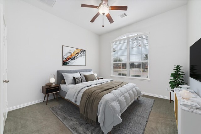 bedroom with baseboards, visible vents, and dark colored carpet