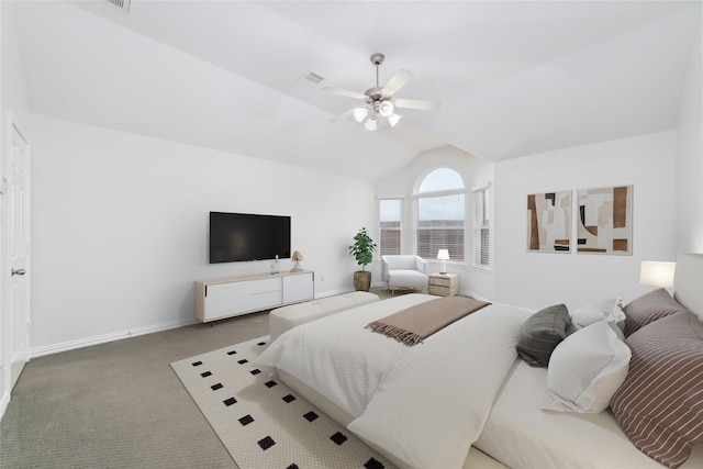 carpeted bedroom with lofted ceiling, baseboards, visible vents, and ceiling fan