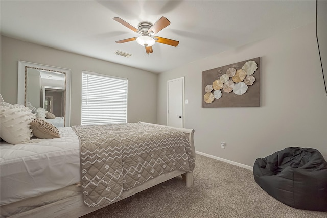 bedroom with baseboards, visible vents, ceiling fan, and carpet flooring