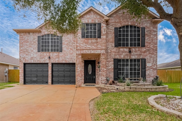 traditional-style home featuring brick siding and fence