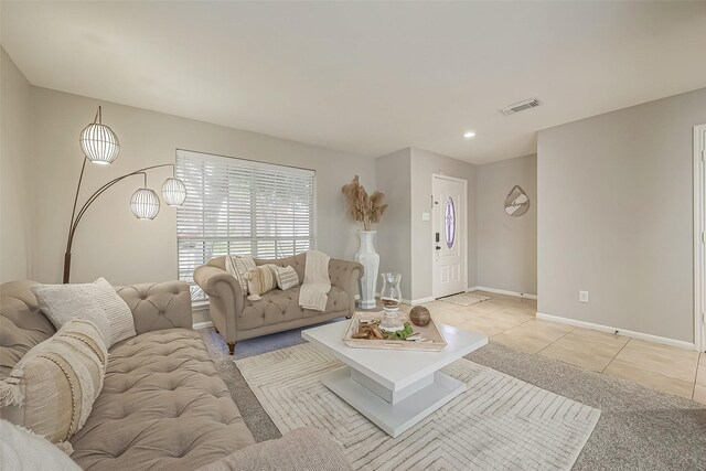 living area with recessed lighting, visible vents, baseboards, and light tile patterned floors