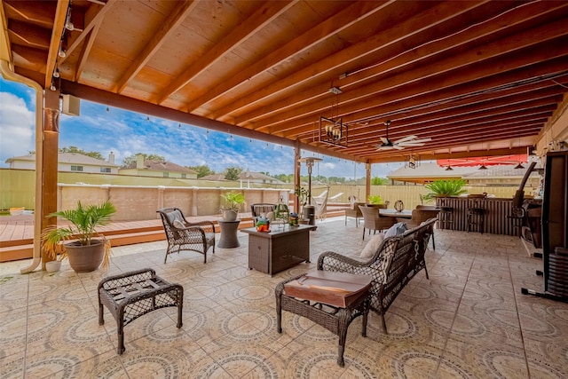 view of patio featuring an outdoor hangout area, outdoor dining space, and fence