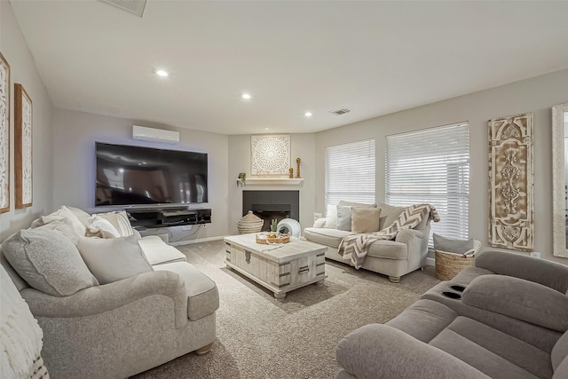 living area featuring recessed lighting, visible vents, a fireplace, and light carpet