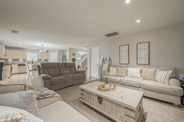 living area featuring recessed lighting, visible vents, stairway, and light tile patterned floors