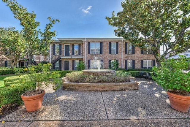 view of front of property featuring brick siding