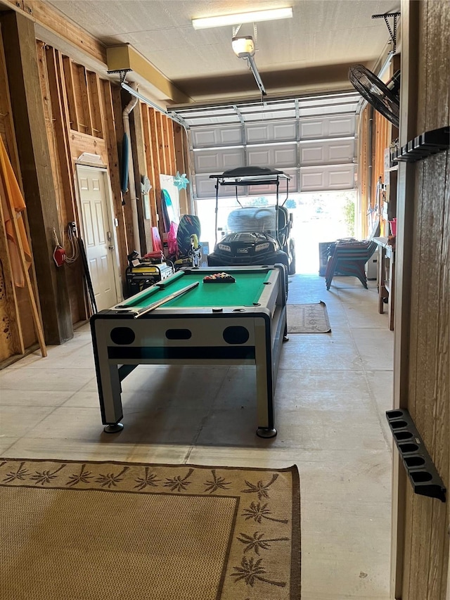 game room with a garage and billiards