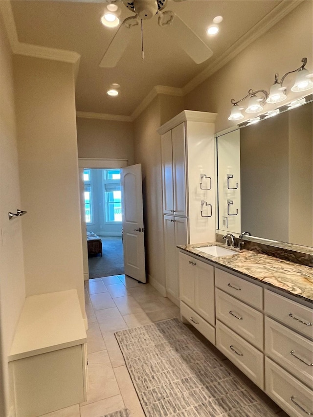 ensuite bathroom with ensuite bathroom, tile patterned flooring, a ceiling fan, vanity, and crown molding