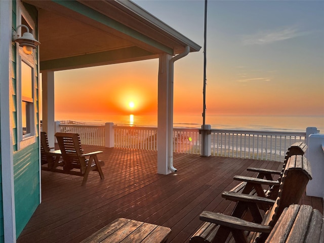 wooden deck with a water view