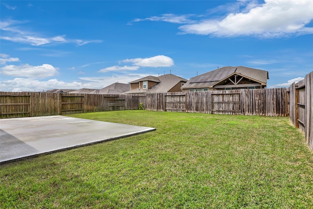 view of yard with a fenced backyard and a patio