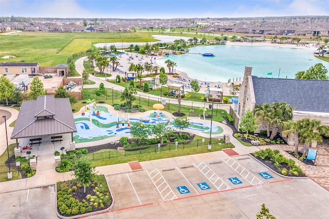 birds eye view of property featuring a residential view and a water view