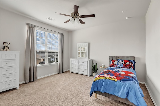 bedroom with ceiling fan, visible vents, baseboards, and carpet flooring