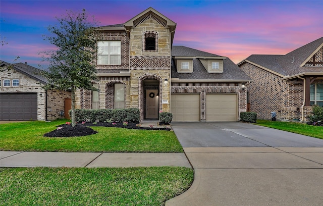 french provincial home with a front yard, brick siding, driveway, and an attached garage