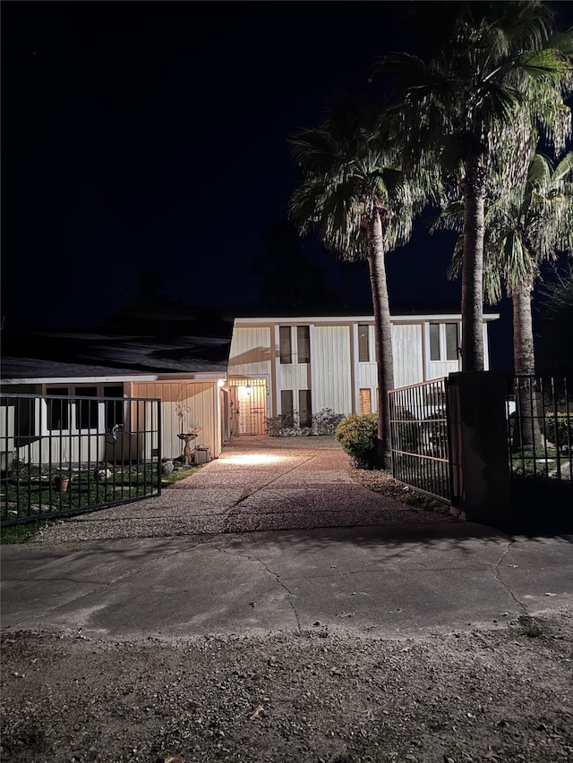 view of front of house featuring a fenced front yard and a gate