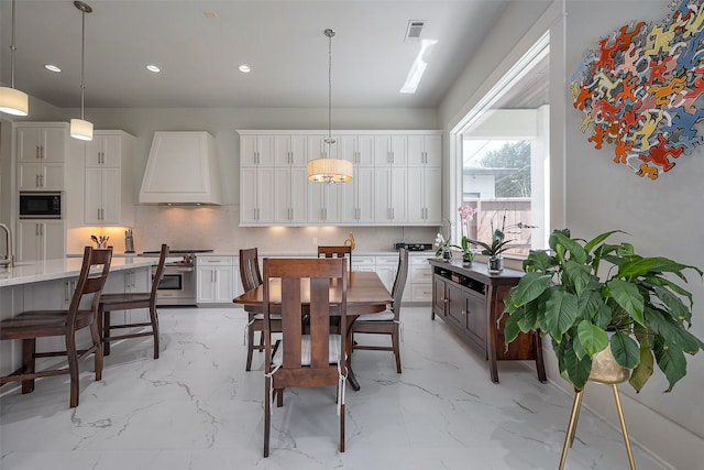 dining area featuring marble finish floor, visible vents, and recessed lighting