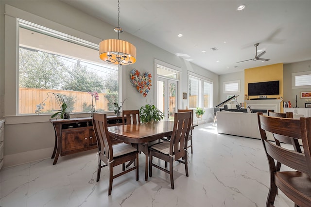 dining room with marble finish floor, french doors, a fireplace, recessed lighting, and ceiling fan