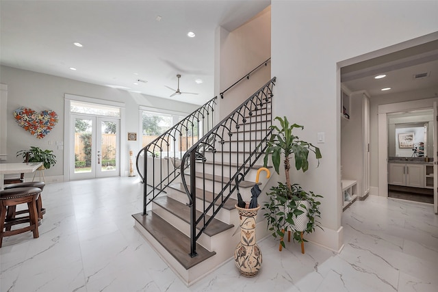 staircase featuring recessed lighting, visible vents, baseboards, marble finish floor, and french doors