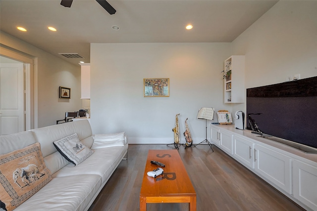 living room featuring a ceiling fan, visible vents, dark wood-type flooring, and recessed lighting