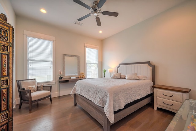 bedroom featuring dark wood-style flooring, recessed lighting, visible vents, ceiling fan, and baseboards