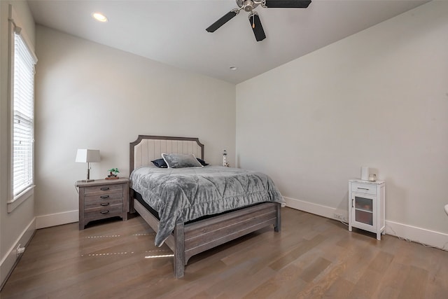 2217 W Main St, Houston, TX 77098 - bedroom with light wood-type flooring, recessed lighting, and a ceiling fan