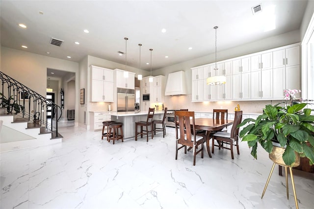 2217 W Main St, Houston, TX 77098 - dining area with stairway and recessed lighting