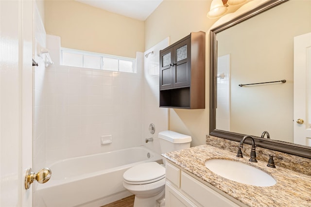 bathroom with toilet, shower / washtub combination, and vanity