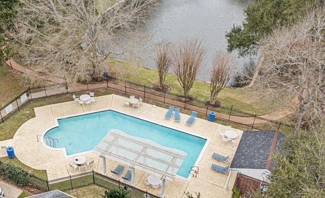 pool featuring a patio area and fence