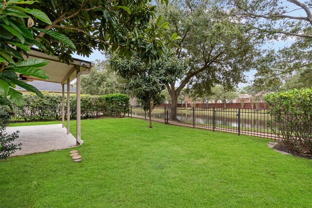 view of yard with fence and a patio