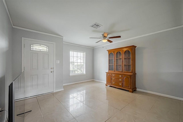 foyer entrance featuring baseboards, visible vents, a ceiling fan, ornamental molding, and light tile patterned flooring