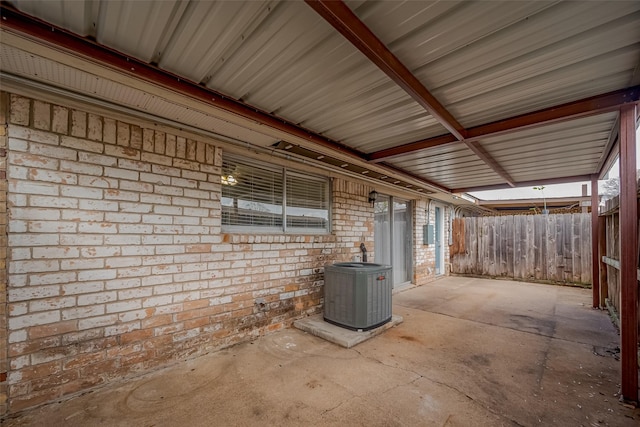 view of patio featuring fence and cooling unit