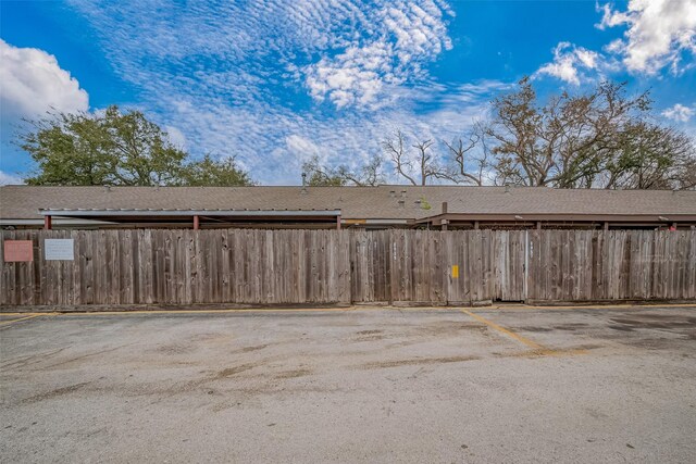 uncovered parking lot with fence