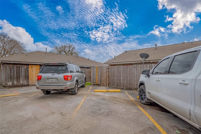 uncovered parking lot with fence