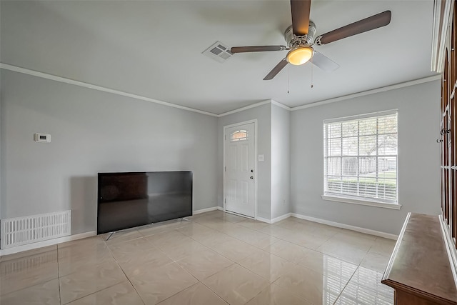 entrance foyer featuring baseboards, visible vents, and crown molding