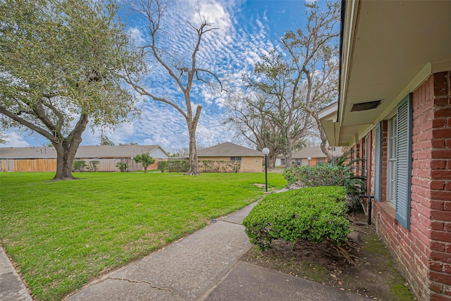 view of yard with fence