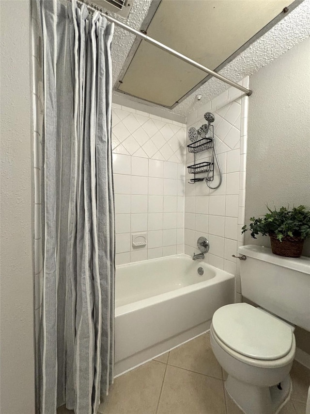 bathroom featuring shower / bath combo, toilet, and tile patterned floors