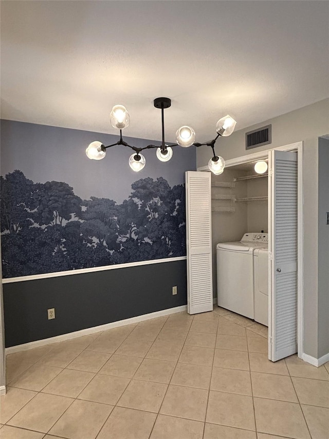 laundry area featuring visible vents, tile patterned flooring, laundry area, independent washer and dryer, and baseboards