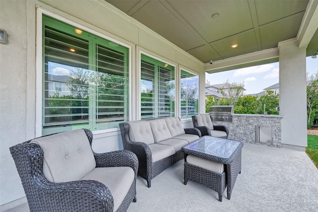 view of patio / terrace with area for grilling, an outdoor kitchen, and an outdoor hangout area