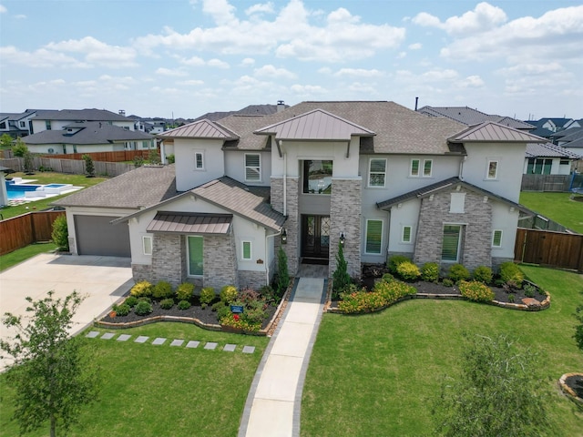 view of front of home with a residential view, metal roof, a standing seam roof, a front yard, and stucco siding