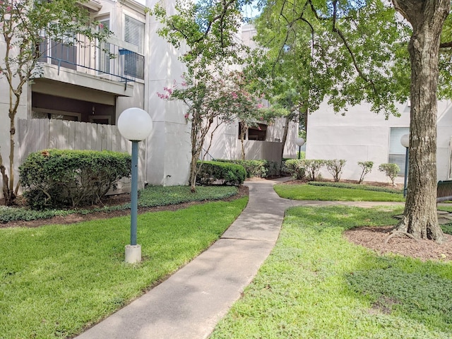 view of home's community with a yard