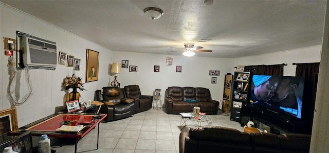 living room with a ceiling fan, light tile patterned flooring, a textured ceiling, and a wall mounted AC