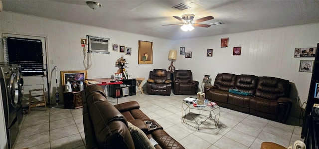 tiled living room with visible vents, ceiling fan, and a wall mounted AC