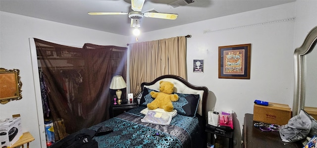 bedroom with ceiling fan and visible vents